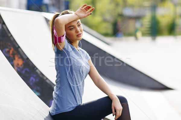 Stock photo: Young woman having exercise outdoors