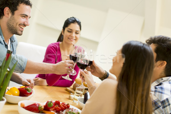 Young people sitting by the table Stock photo © boggy