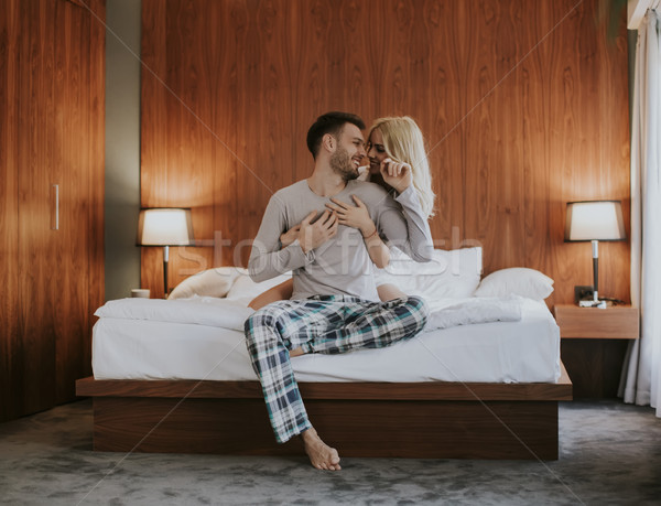 Loving couple on the bed Stock photo © boggy