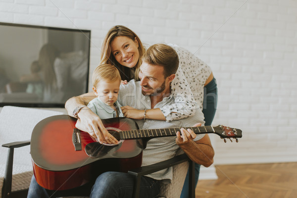 Young family with guiitar Stock photo © boggy