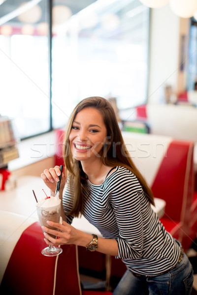 Woman drinks  milkshake at the diner Stock photo © boggy