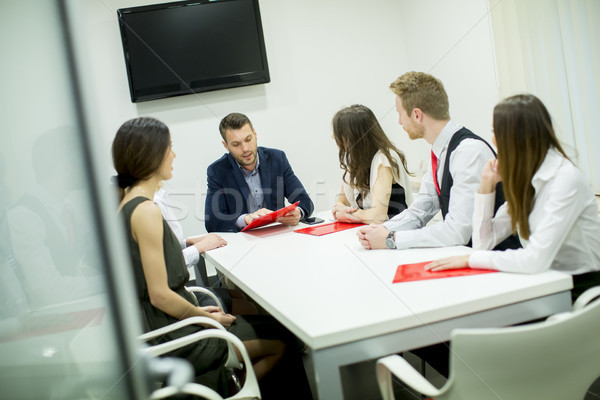 Image of business partners discussing documents and ideas at mee Stock photo © boggy