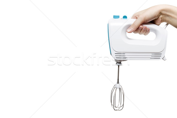 Stock photo: Electric food mixer in hand on white background
