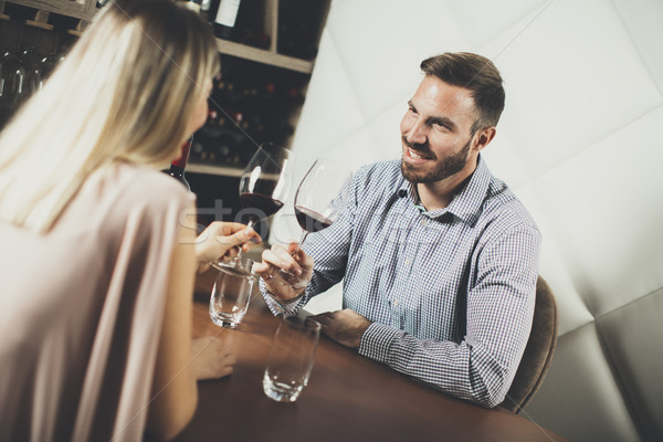 Handsome young couple on the date in wine bar Stock photo © boggy