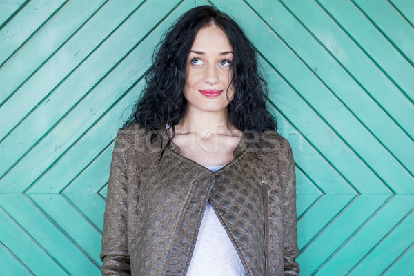 Young woman by the old door Stock photo © boggy