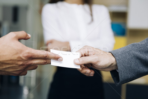 Closeup of businesspeople exchanging business card Stock photo © boggy