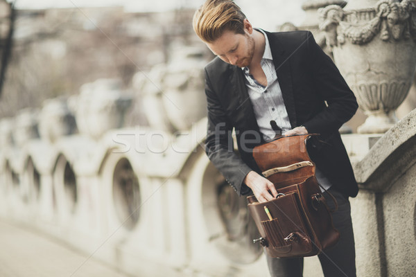 Young businessman on the street Stock photo © boggy