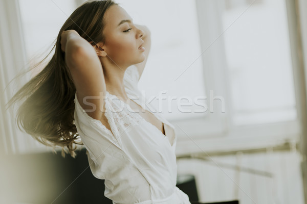 Young woman on the bed Stock photo © boggy