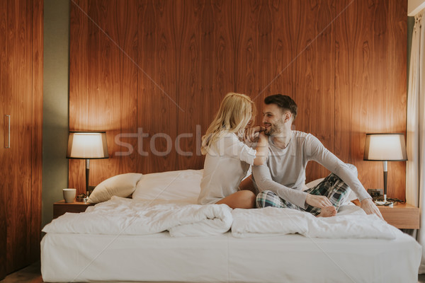 Fiatal felnőtt heteroszexuális pár ágy hálószoba otthon nő Stock fotó © boggy