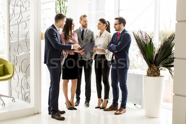Business partners analyze the business results in modern office Stock photo © boggy