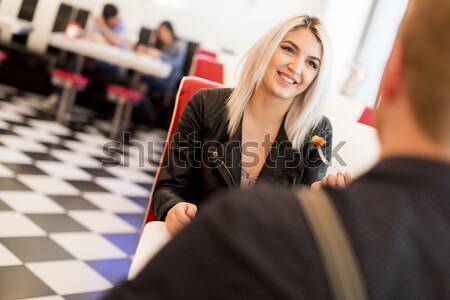 Friends eating in diner Stock photo © boggy