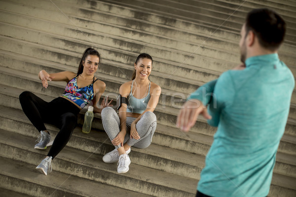 Young people  resting on stairs after training Stock photo © boggy