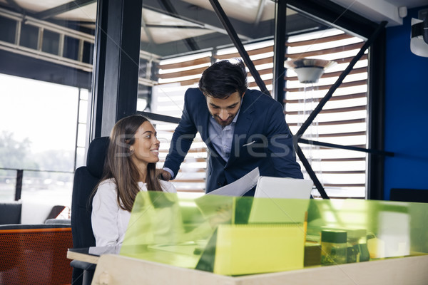 Stock photo: Young business people working in modern office