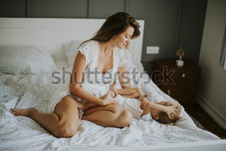 Terhes nő visel fehérnemű pózol szoba fotó Stock fotó © boggy