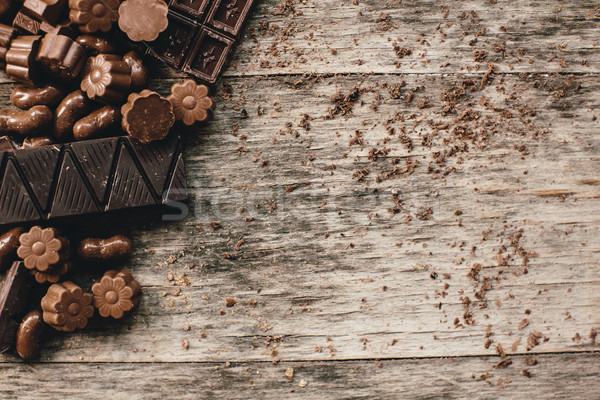 Chocolate and praline on a wooden base Stock photo © boggy