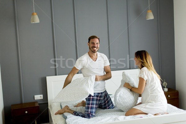 Mutlu çift yastık kavgası yatak odası kadın oda Stok fotoğraf © boggy