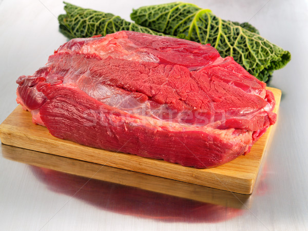 Raw beef flesh on cutting board Stock photo © bogumil