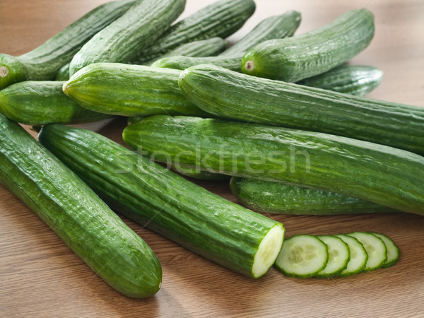 Arrangement of fresh cucumbers on a wooden decks Stock photo © bogumil