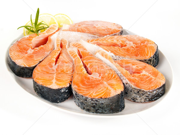 Stock photo: Raw salmon steaks on a plate