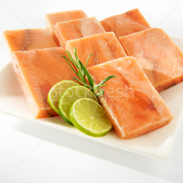 Congelés saumon brut cubes plaque Photo stock © bogumil