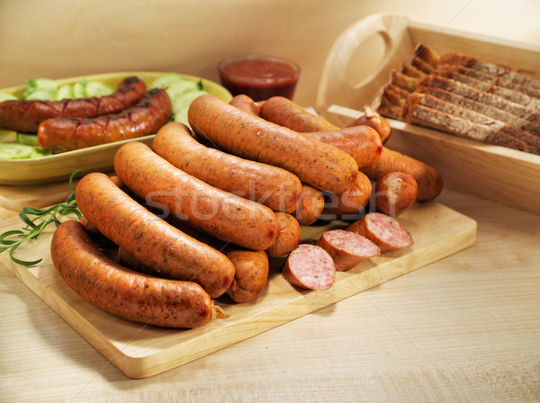 Grilled sausage with bread, cucumber and tomato ketchup Stock photo © bogumil