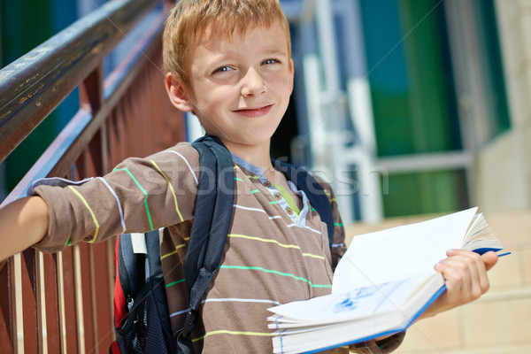 Young schoolboy with book Stock photo © bogumil