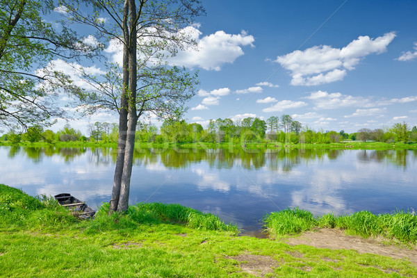 The Narew River Scenery. Old boat on riverbank. Stock photo © bogumil