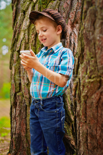 Young kid with phone Stock photo © bogumil