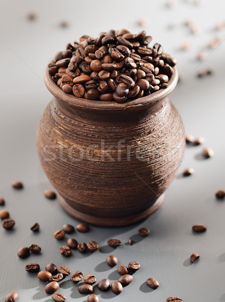 Old grungy pot full of roasted coffee beans. Stock photo © bogumil