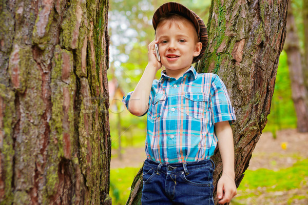 Young kid talking on mobile phone Stock photo © bogumil
