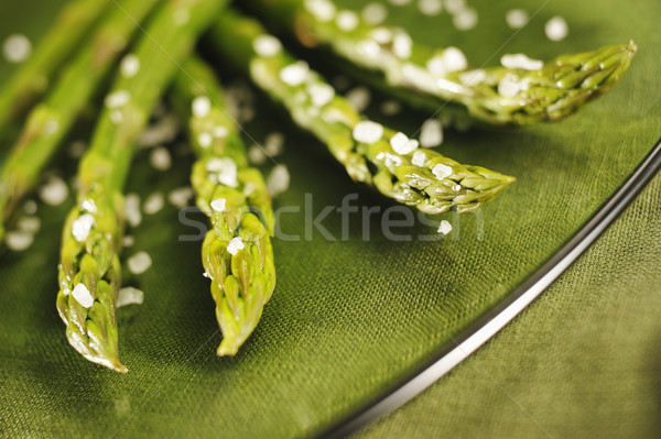 Asparagus with salt on a glass dish Stock photo © bogumil