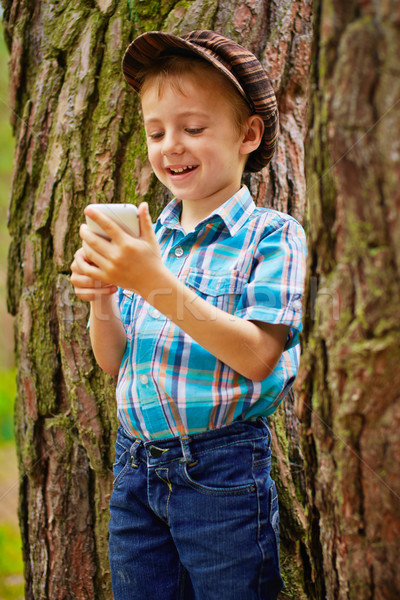 Young boy with phone Stock photo © bogumil