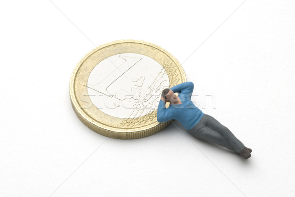 Alszik eurók férfi báb Euro érme Stock fotó © bonathos