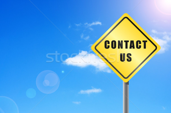 Traffic sign contact us  sky background. Stock photo © borysshevchuk