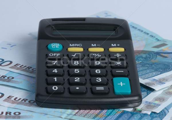 Calculator with paper money. Stock photo © borysshevchuk
