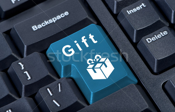 Button keypad with gift box icon. Stock photo © borysshevchuk