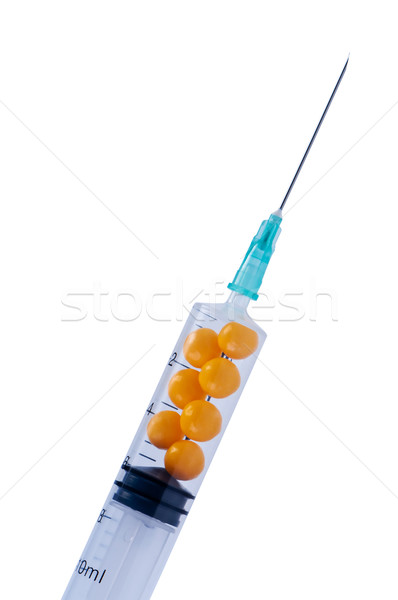 Syringe with pills isolate on white. Stock photo © borysshevchuk