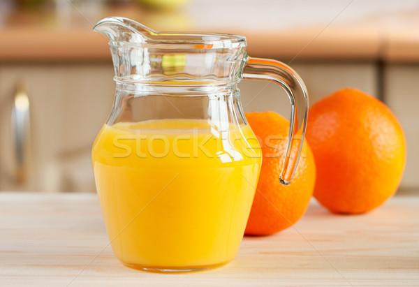 Fresh orange juice and oranges. Stock photo © borysshevchuk