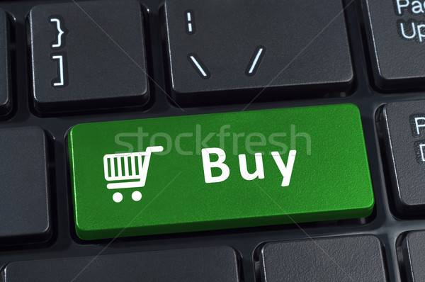 Buy button computer keyboard with trolley icon. Stock photo © borysshevchuk