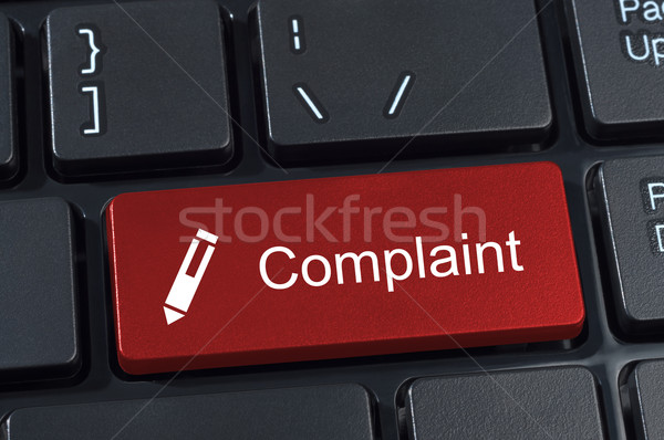 Complaint button keyboard with pen icon. Stock photo © borysshevchuk