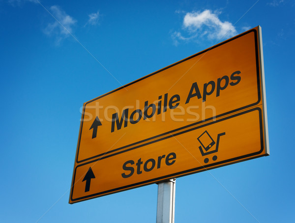 Mobile apps road sign with cart and smartphone. Stock photo © borysshevchuk