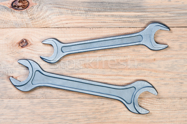 Wrenches on a wooden board. Stock photo © borysshevchuk