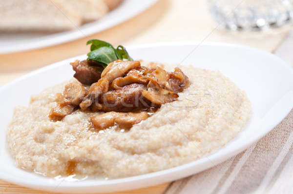 Porridge with fried mushrooms. Stock photo © borysshevchuk
