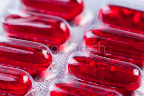 Red pills in packing close up. Stock photo © borysshevchuk