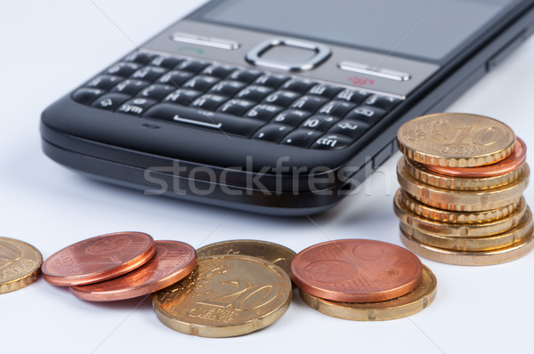 Mobiele telefoon munten geld cellulaire business Stockfoto © borysshevchuk