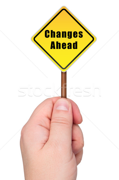 Road sign in hand changes ahead. Stock photo © borysshevchuk