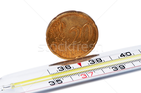 Medical thermometer with euro cent coin. Stock photo © borysshevchuk