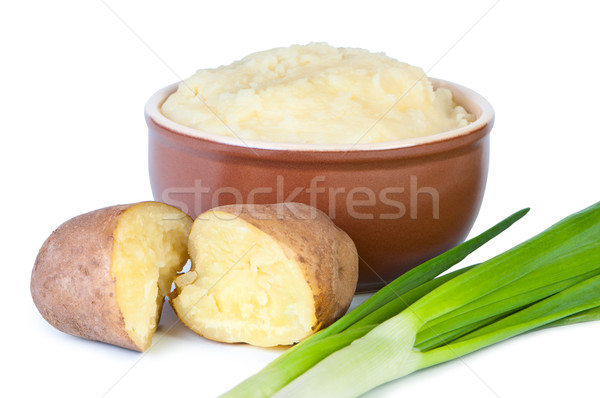 Mashed potatoes with green onions on white background. Stock photo © borysshevchuk
