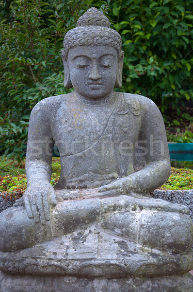 Stone Buddha in the lotus position. Stock photo © borysshevchuk