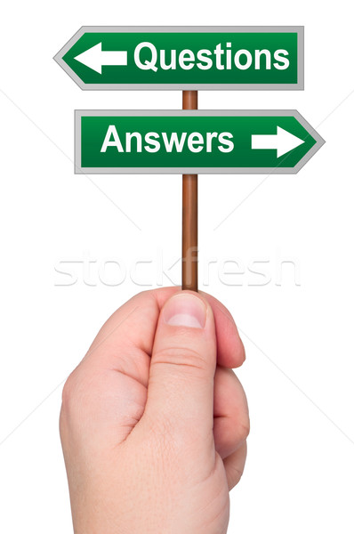 Hand holding road sign with directions Questions Answers. Stock photo © borysshevchuk